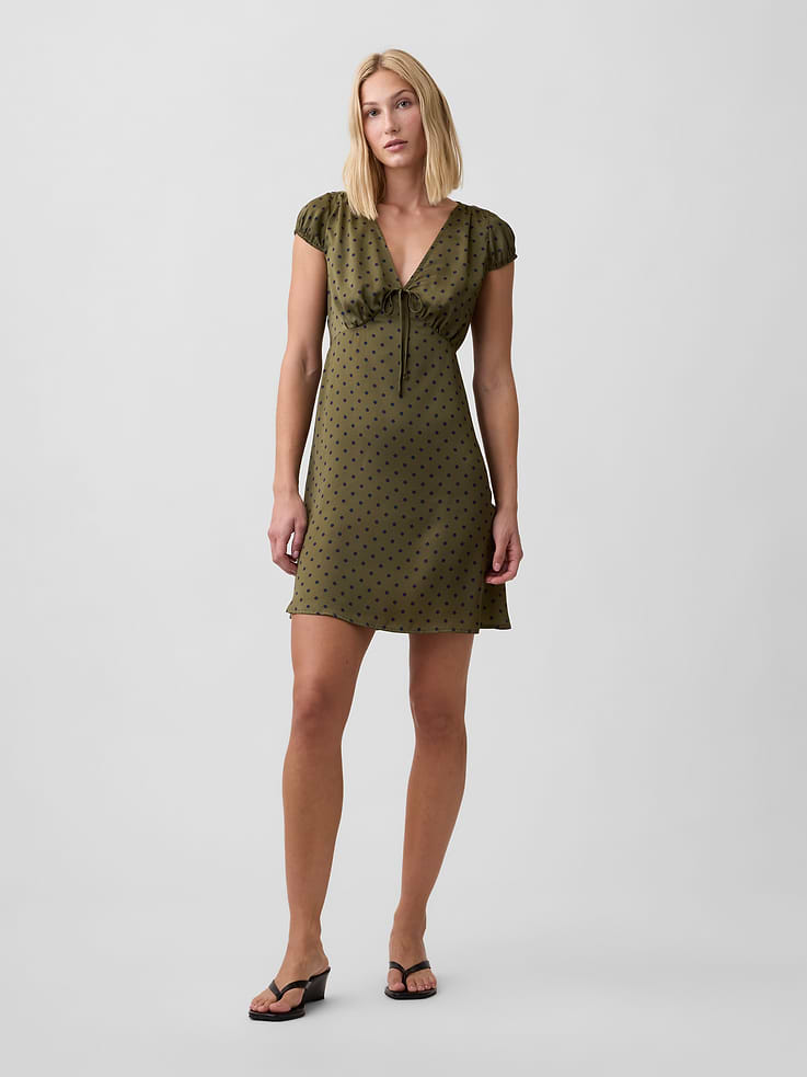 Image 1 of 6, Smooth weave., Puff cap sleeves., Ties and shirring at V-neck., Select styles have allover print., This product was made in a factory that invests in gender equity and women’s empowerment through RISE. Learn more at, Product #1184409