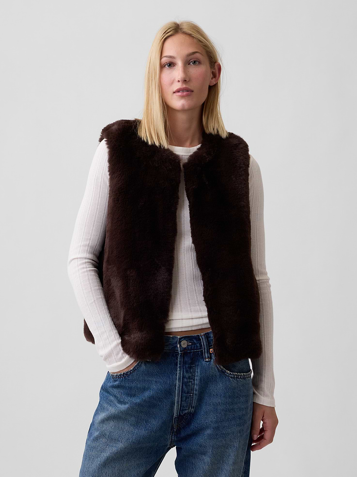 Image 1 of 5, This product is made with/contains 100% recycled polyester. Compared to virgin materials, using recycled materials helps reduce resource use and waste, Cozy faux fur., Sleeveless., Round neckline, zip front., This product was made in a factory that invests in gender equity and women’s empowerment through RISE. Learn more at, Product #1178412