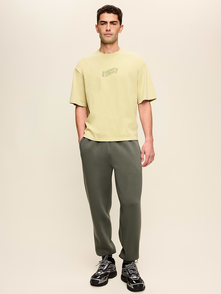 Image 1 of 6, Make your moves in Old Navy Sport's Bounce Fleece: Our signature smooth spacer fabric that keeps its shape., elastic-drawstring waistband, faux fly, side pockets, welt pocket at back right, rib-knit cuffs, 4-way stretch, breathable, Product #907896