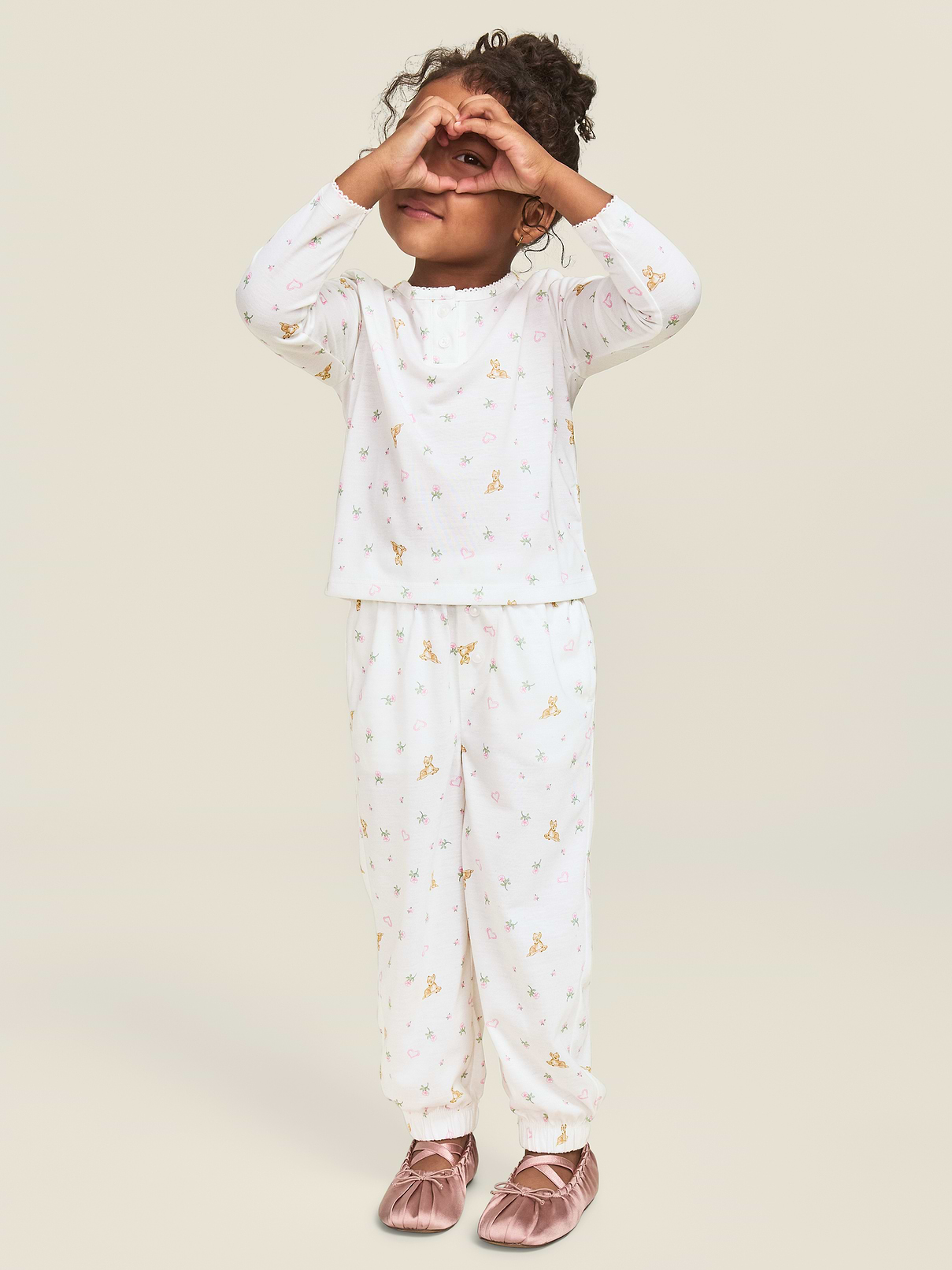 Image 1 of 4, round neckline, two-button placket, long sleeves, matching pajama pants, elasticized waistband, two-button placket, cinched leg cuffs, licensed graphic, ©Disney, Product #1185023