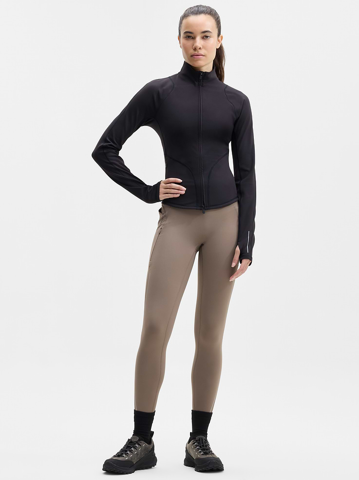 Image 1 of 5, FOR: Your toughest cold-weather training sessions, FEEL: Plush SuperSonic has a brushed interior with supportive compression, FAVE: Reflective details for workouts at dawn or dusk, Secure side zip pockets with a new earbud pocket, Continuous drawstring, Our #1 cold-weather legging is back with a new refined fit. Featuring no front seam, modernized lines, and more reflectivity., Product #1179346
