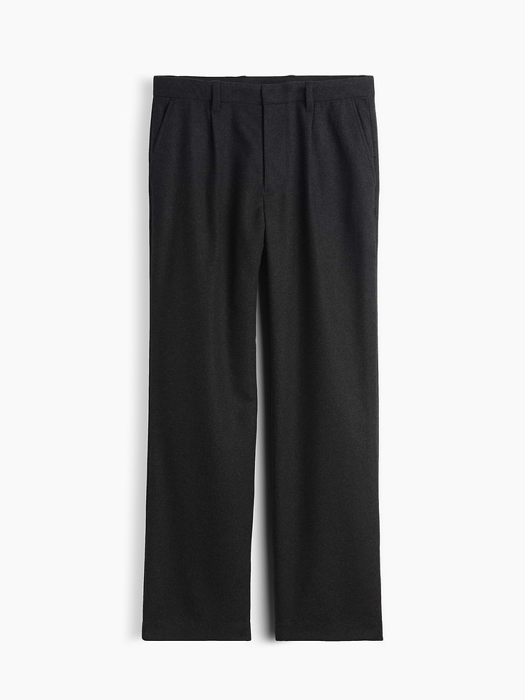 Image 1 of 2, Soft wool-blend trouser pants. In a loose fit., Hidden hook-and-bar closure, zip fly., Pleated front., Side slant pockets, back welt pockets., Made with 50% recycled polyester. Compared to virgin materials, using recycled materials helps reduce resource use and waste., This product was made in a factory that invests in gender equity and women’s empowerment through RISE. Learn more at gapinc.com/equity ., Product #1184867