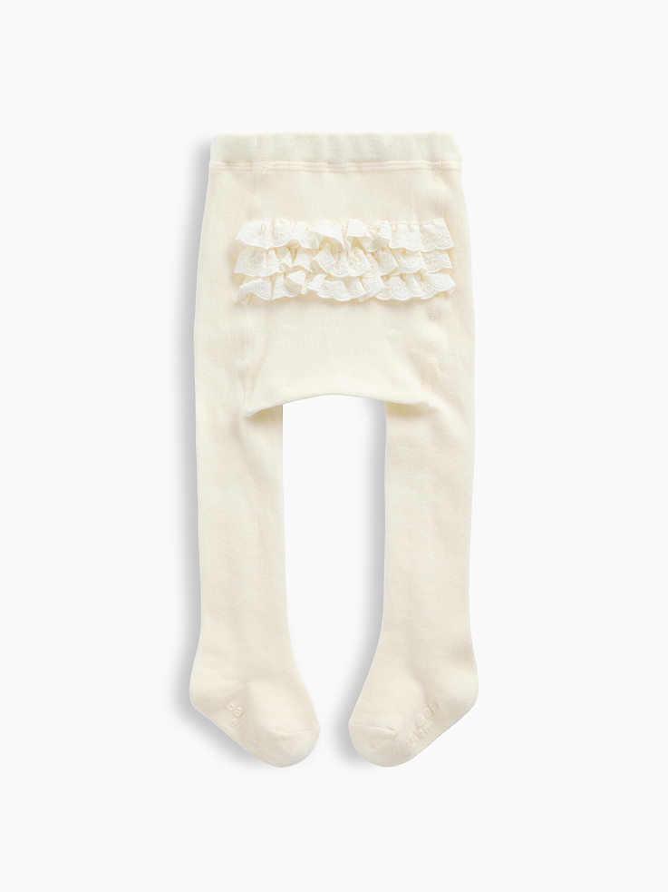 Image 1 of 2, Soft, stretch knit baby tights., Elasticized waist., Ruffle detailing at back., Reinforced toe and heel., This product was made in a factory that invests in gender equity and women’s empowerment through RISE. Learn more at gapinc.com/equity ., Product #1185481