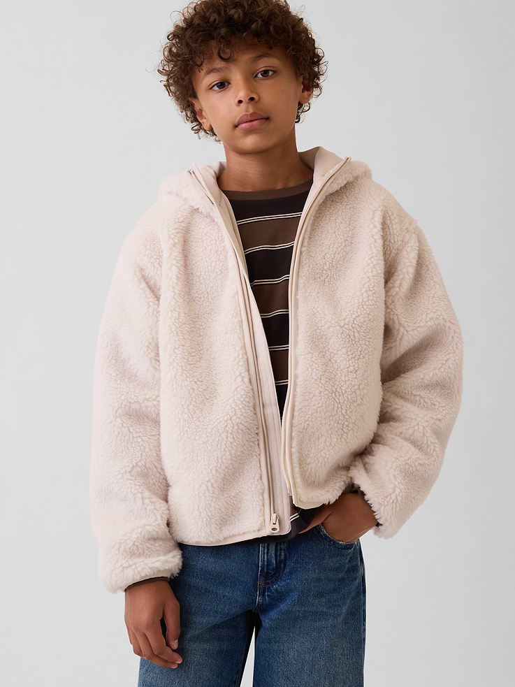 Image 1 of 5, Soft sherpa full-zip jacket. In a relaxed fit., Hooded neckline., Long sleeves with drop shoulders., Zipper front., Side on-seam pockets., Binding at cuffs and hem., Fully lined., Explore the Gap Gift Shop ., Product #909136