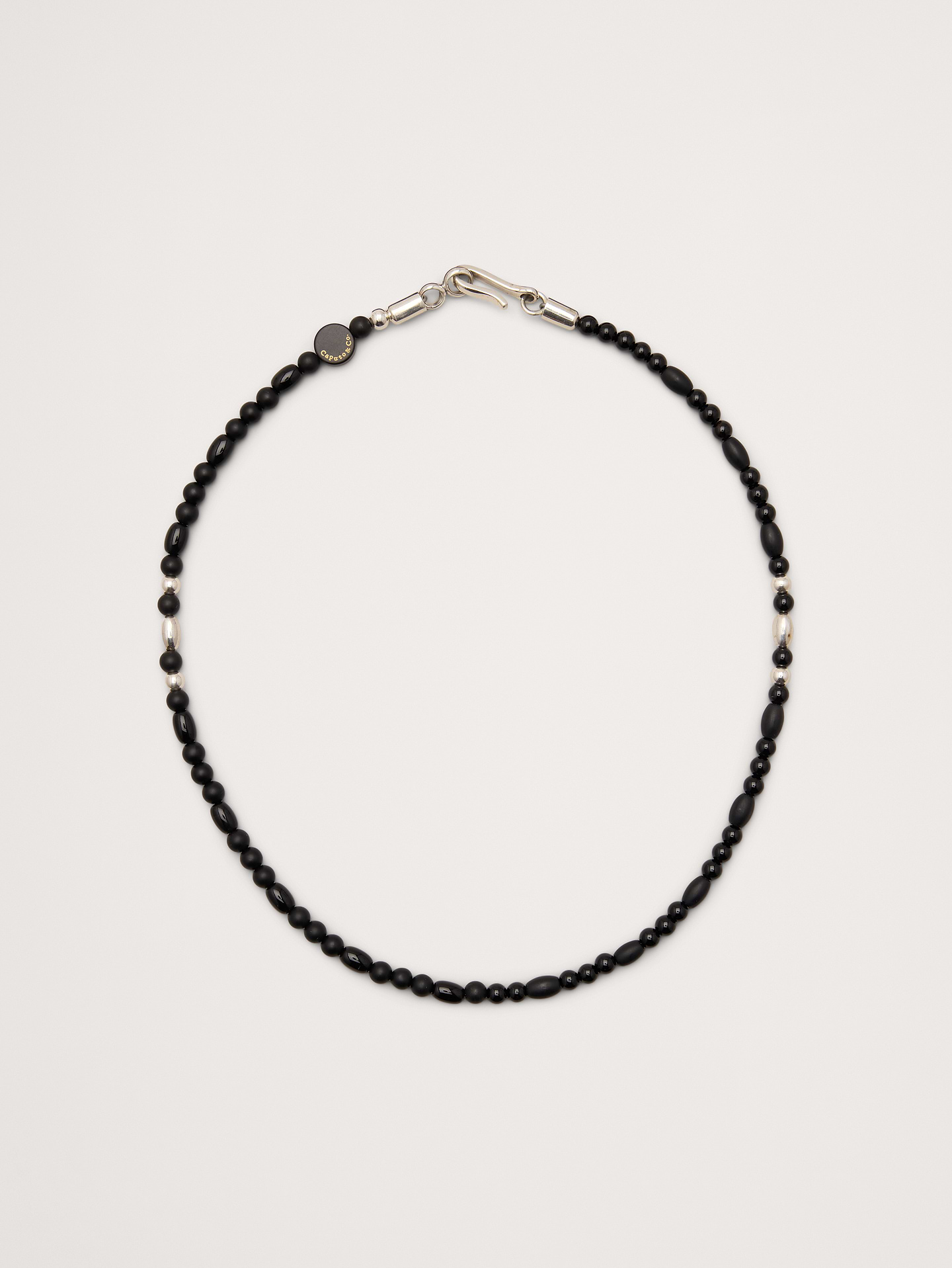 Image 1 of 2, A double-wrap bracelet with matte and polished black onyx with sterling silver accents., Caputo & Co: Modern artisanal accessories that marries American soul with Central American heart. Handcrafted sterling silver, premium gemstones, and quality leathers., Hook-and-eye closure., Product #1200077