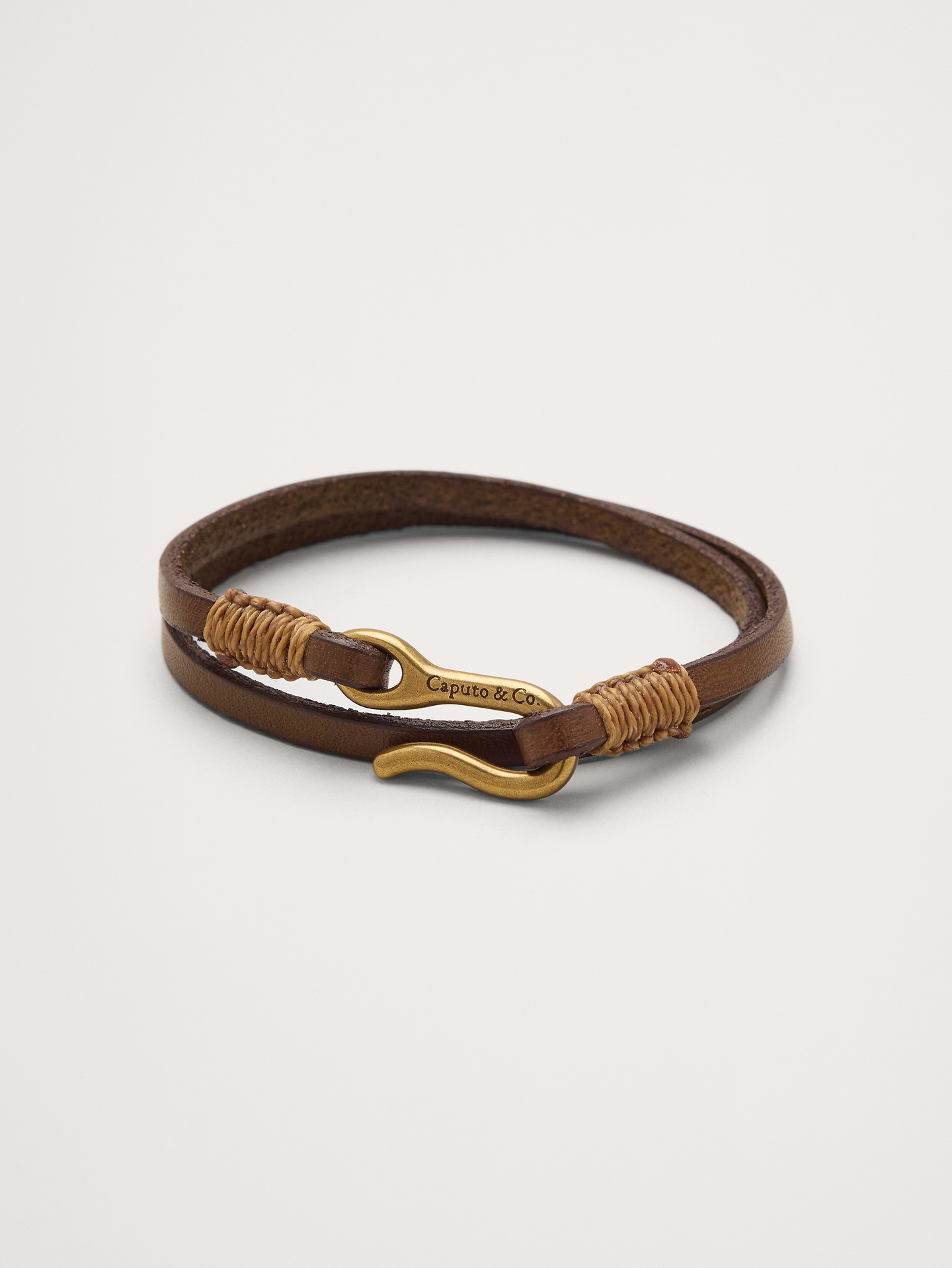 Image 1 of 3, This double-wrap bracelet is crafted from vegetable-dyed leather with a brass hook closure., Caputo & Co: Modern artisanal accessories that marries American soul with Central American heart. Handcrafted sterling silver, premium gemstones, and quality leathers., Hook closure., Product #1200074