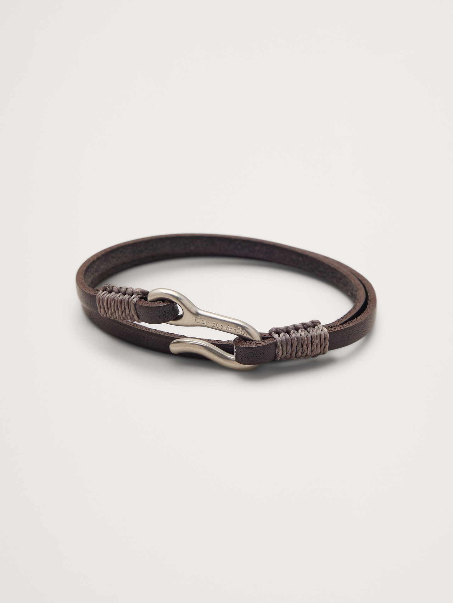 Image 1 of 3, This double-wrap bracelet is crafted from vegetable-dyed leather with a brass hook closure., Caputo & Co: Modern artisanal accessories that marries American soul with Central American heart. Handcrafted sterling silver, premium gemstones, and quality leathers., Hook closure., Product #1200074