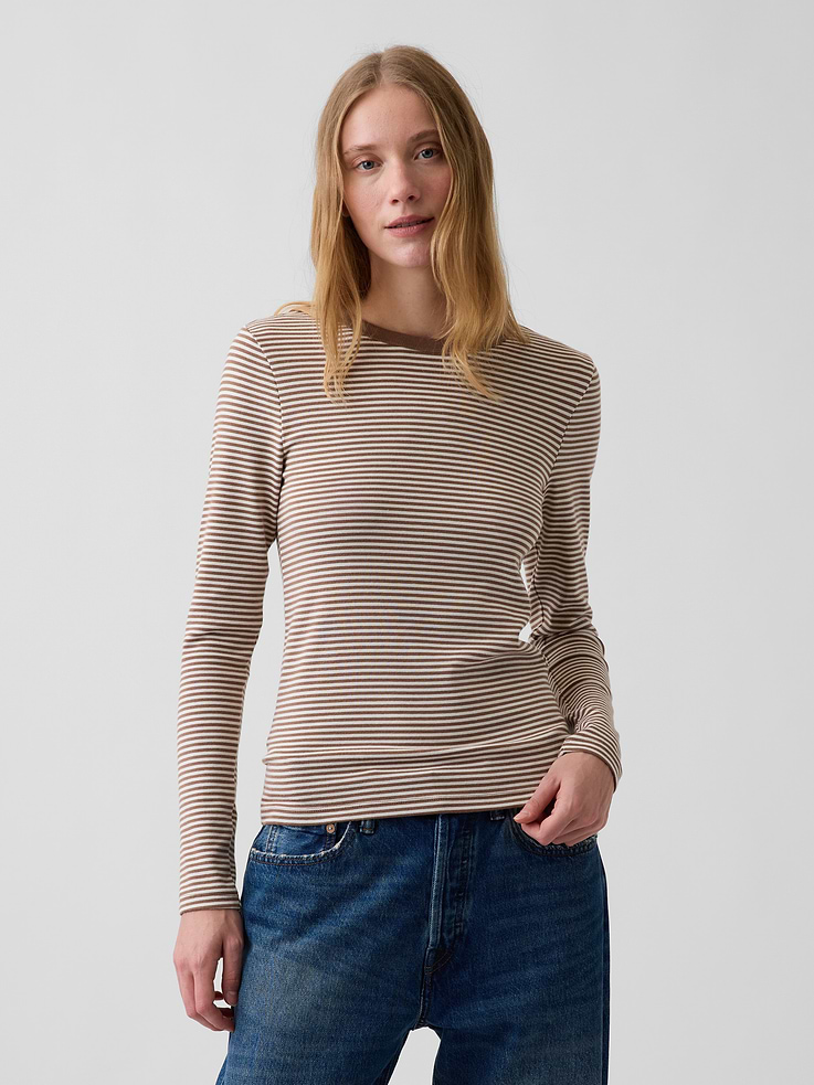 Image 1 of 5, Our soft & stretchy cotton-modal blend that hugs you just right. It’s your new 7-days-a-week essential., Soft, stretch cotton-modal blend T-Shirt in a slightly cropped length., Crewneck., Long sleeves., This product was made in a factory that invests in gender equity and women’s empowerment through RISE. Learn more at gapinc.com/equity ., Product #801470