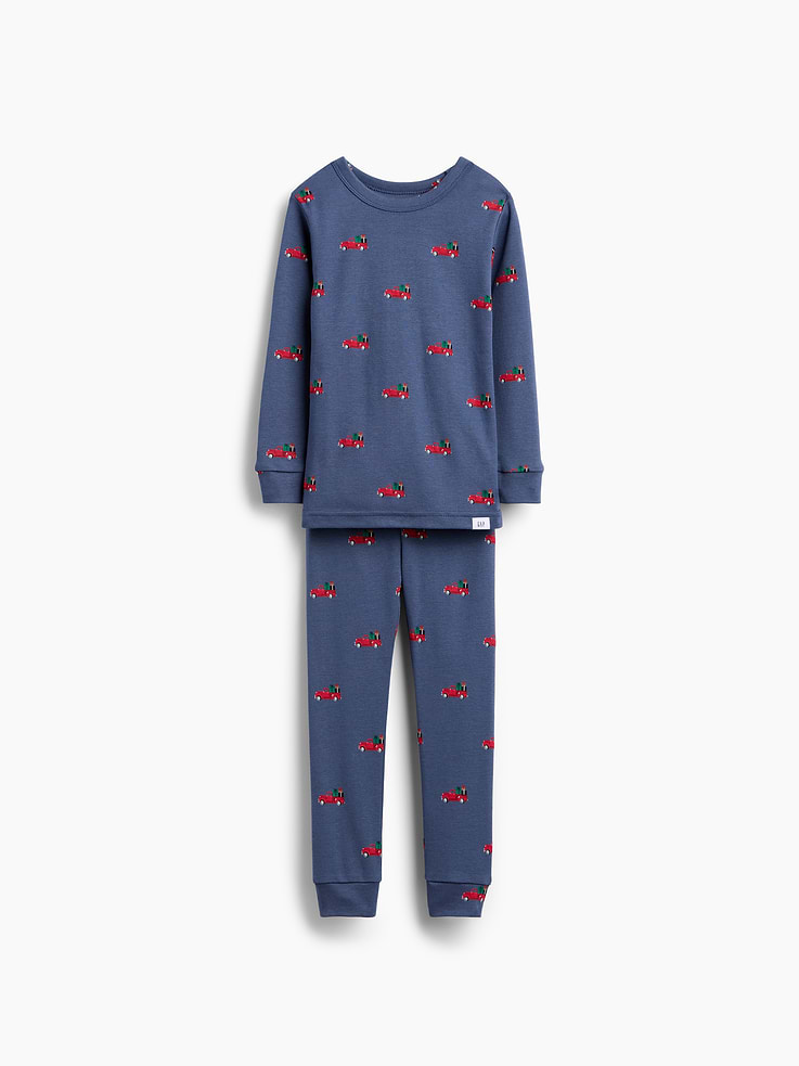 Image 1 of 4, Our comfiest PJs—now softer than ever. Cozy brushed cotton on the inside. All their favorite prints & colors on the outside., Soft cotton pajama top and pants PJ set with a cozy brushed interior., Crewneck., Long sleeves., Elasticized waist at PJ pants., Banded cuffs., Allover print., Made with 100% organically grown cotton, which is grown without the use of synthetic pesticides and fertilizers., Note: Sizing for select prints extends up to 12 YRS for certain styles., Shop matching PJs for all., This product was made in a factory that invests in gender equity and women’s empowerment through RISE. Learn more at gapinc.com/equity ., Product #915908