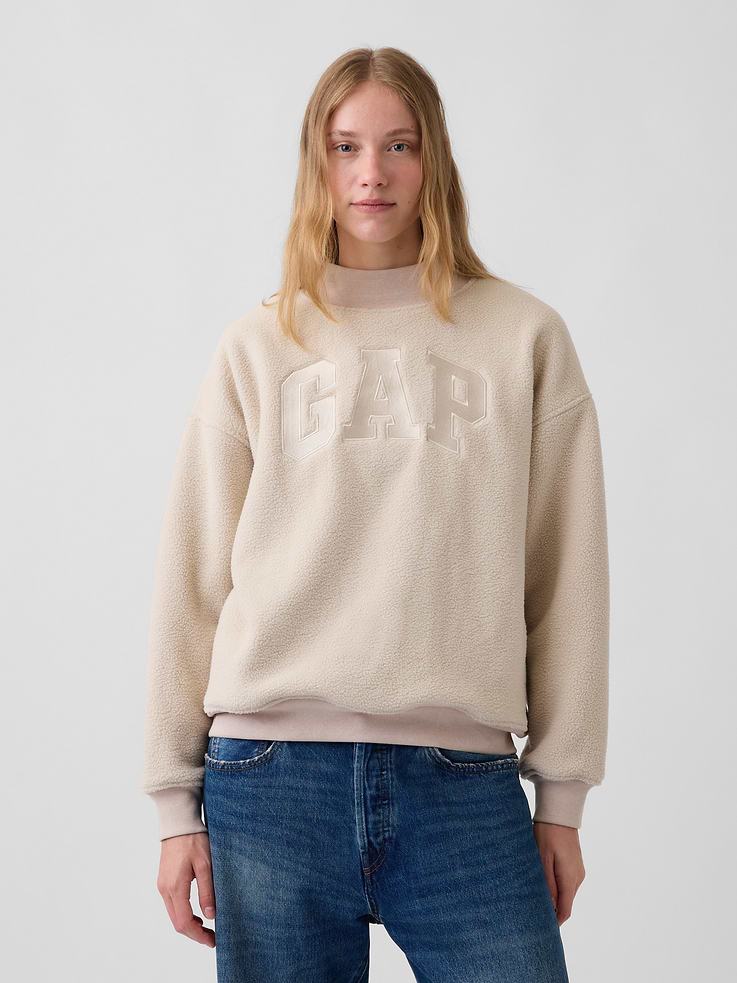 Image 1 of 5, Soft sherpa sweatshirt. In an ultra oversized fit and longer length., Mockneck., Long sleeves with drop shoulders., Gap arch logo at front., Banded rib cuffs and hem., Sherpa made with 25% recycled polyester. Compared to virgin materials, using recycled materials helps reduce resource use and waste., Product #1186607