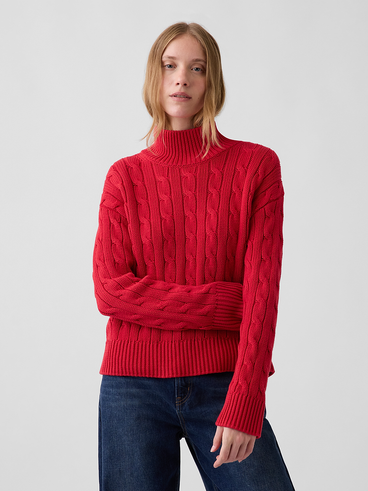 Image 1 of 5, Soft knit cotton sweater. In an oversized fit and slightly cropped length., Mockneck., Long sleeves with drop shoulders., Ribbed cuffs and hem., This product was made in a factory that invests in gender equity and women’s empowerment through RISE. Learn more at gapinc.com/equity ., Product #1186084