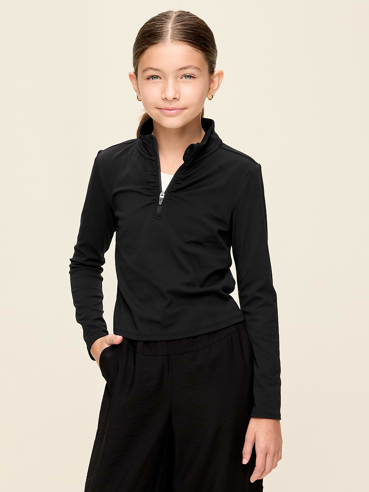 Image 1 of 4, Keep ‘em moving in Old Navy Sport's StudioSmooth: A buttery soft, breathable fabric for all her everyday moves., half-zip front, ruching at front, long sleeves, thumbhole slits at cuffs, pull-over style, Product #907924