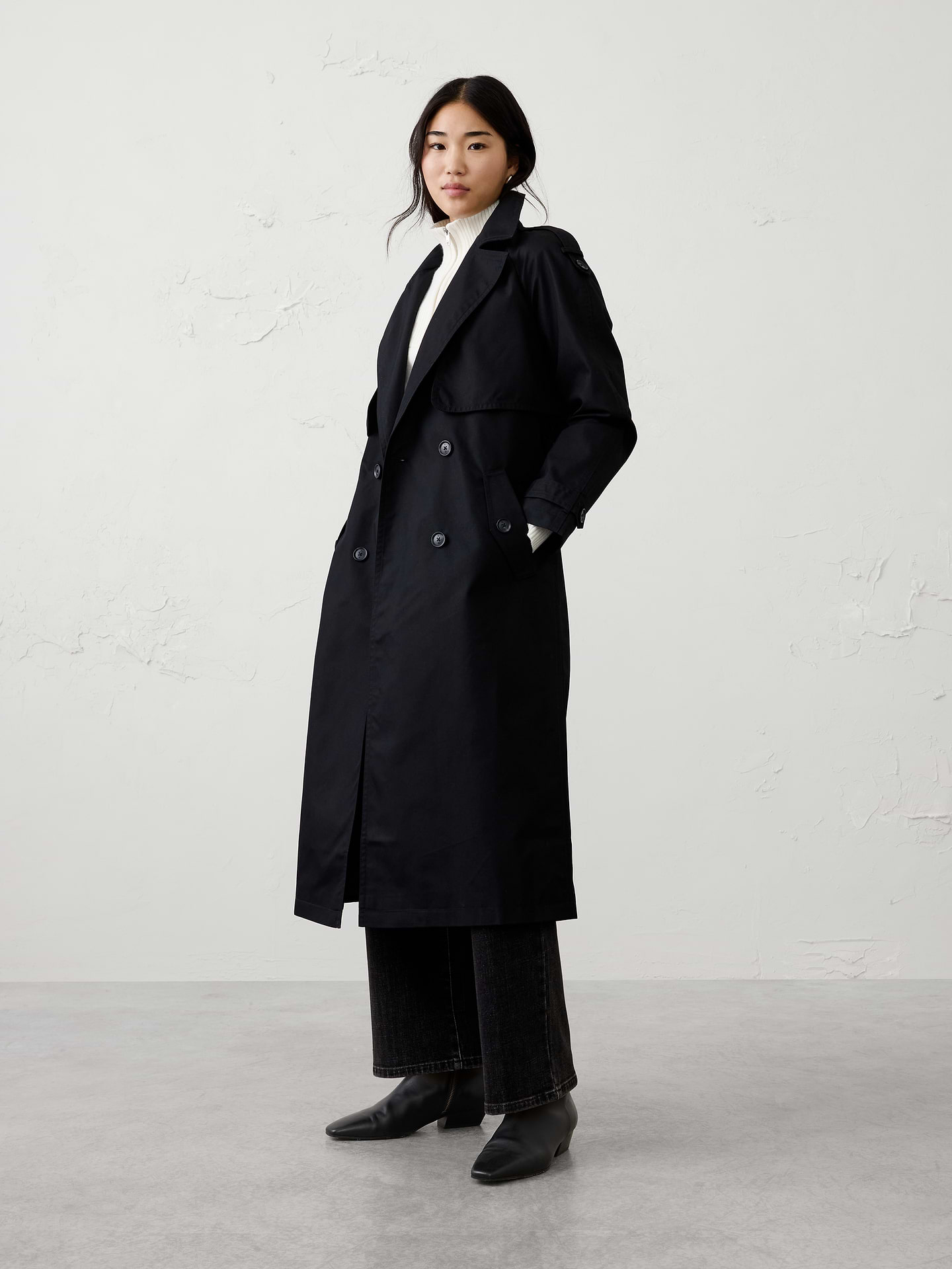 Image 1 of 8, Our updated trench coat features a slimmer, more classic fit with shoulder epaulettes and storm flaps. Crafted from our water-resistant fabric, it's designed for all-weather wear., Notch collar. Long sleeves with button tab sleeves., Double breasted button closure., Epaulettes on shoulder., Front and back storm flaps., Fully lined., Fabric belt included., Made exclusively for Banana Republic Factory., Product #484353
