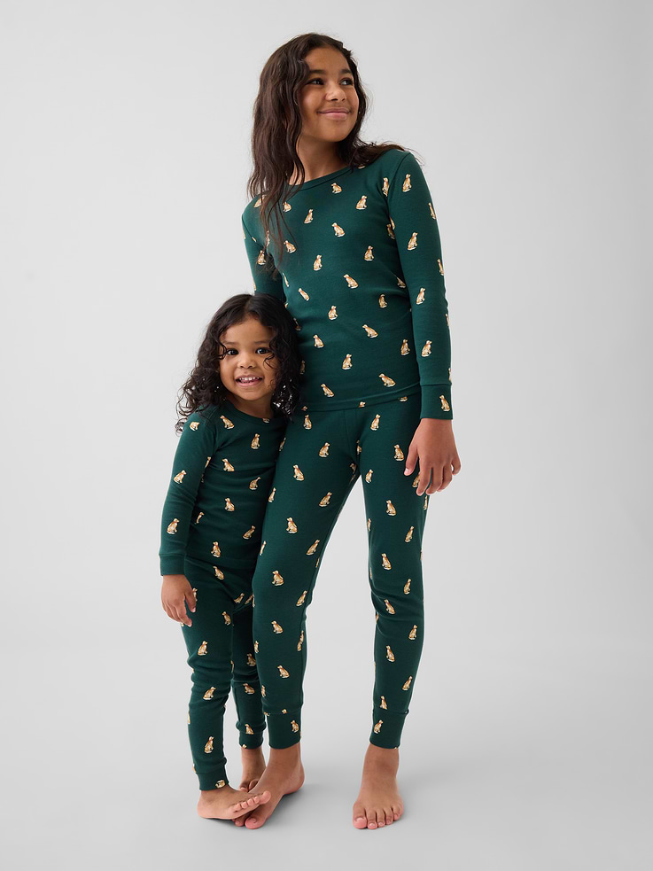 Image 1 of 5, Our comfiest PJs—now softer than ever. Cozy brushed cotton on the inside. All their favorite prints & colors on the outside., Soft cotton pajama top and pants PJ set with a cozy brushed interior., Crewneck., Long sleeves., Elasticized waist at PJ pants., Banded cuffs., Allover print., Made with 100% organically grown cotton, which is grown without the use of synthetic pesticides and fertilizers., Note: Sizing for select prints extends up to 12 YRS for certain styles., Shop matching PJs for all., This product was made in a factory that invests in gender equity and women’s empowerment through RISE. Learn more at gapinc.com/equity ., Product #915908