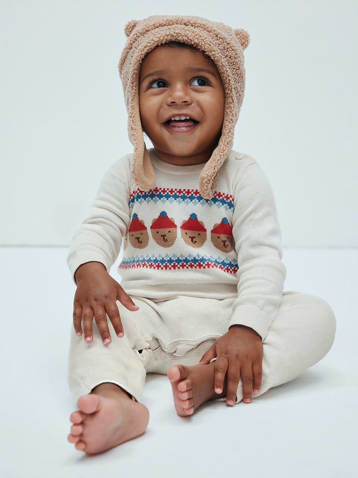 Image 1 of 4, Soft cotton knit., Long sleeves with ribbed cuffs., Ribbed crewneck, buttons at shoulder., Hidden snaps at inseam for easy dressing and diapering., Ribbed cuffs., Select styles have allover print or stripes., This product was made in a factory that invests in gender equity and women’s empowerment through RISE. Learn more at, Product #1177225