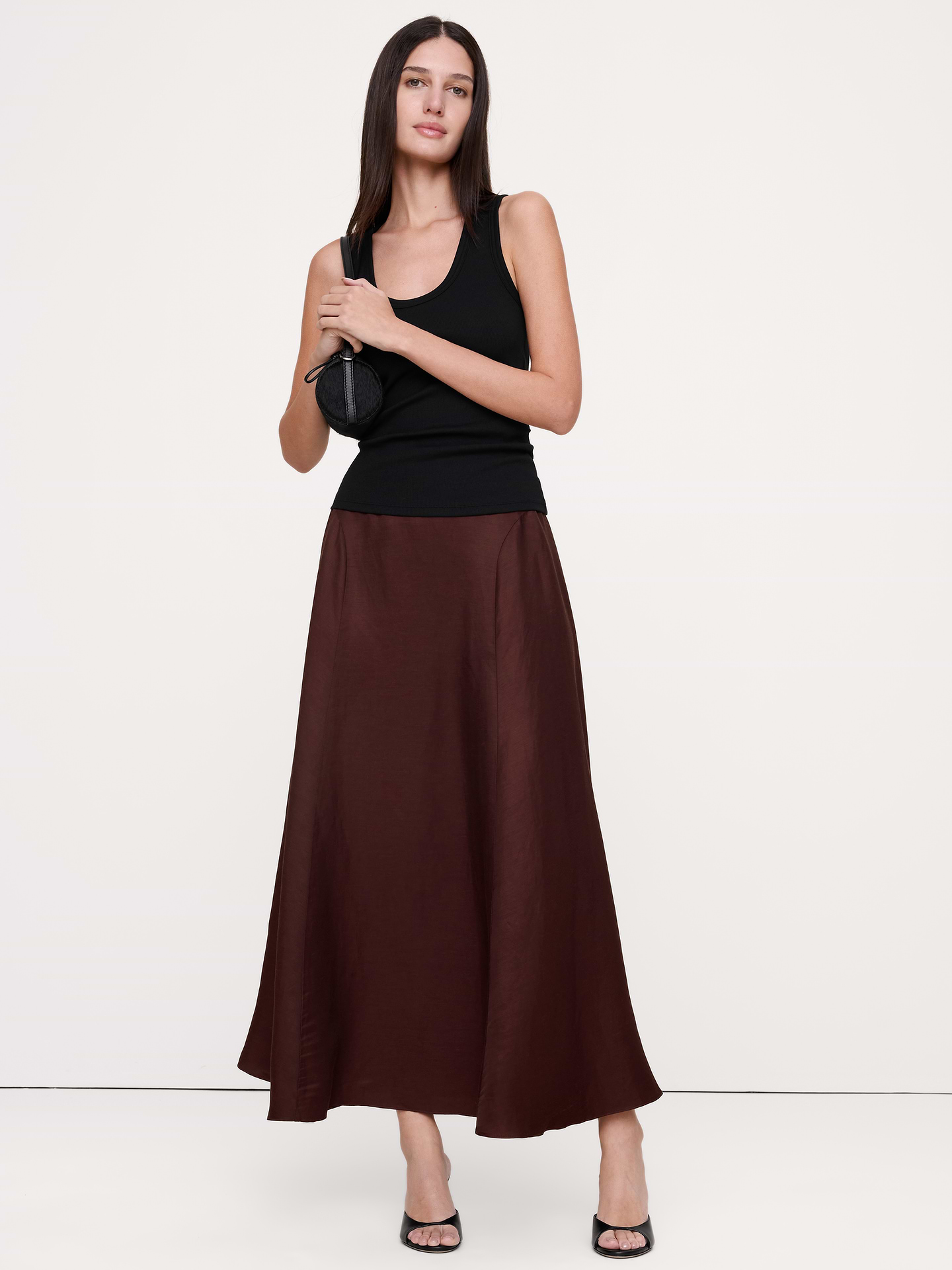 Image 1 of 5, Reach for this floating maxi skirt on days you want to look and feel great. We cut it with panels at the sides to enhance it's flowing shape, crafting it in a silky blend of viscose and linen—an ideal choice in hot, humid weather., A-Line fit: High rise. Fitted waist with a flare silhouette., Elastic waistband with invisible zip at back., Unlined., Product #900008
