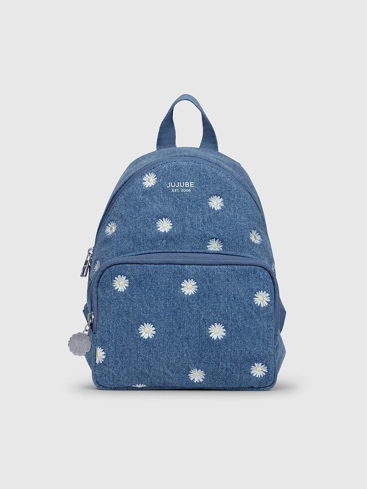 Image 1 of 5, Small but mighty, this charming mini backpack is as cute as it is functional!, It's made with a 100% cotton exterior that showcases a light blue denim, embroidered daisies and, and a cheerful yellow gingham lining for an extra pop of cheer., Thoughtfully designed, it features interior bottle pockets that fit two baby bottles or water bottles, a padded back slip pocket for a small tablet or changing pad, and a zippered front pocket for wipes or a phone., A small interior pocket keeps keys and other valuables secure, while the spacious main compartment is ideal for everyday essentials., Padded, adjustable straps and a cushioned back panel ensure all-day comfort, and a special silver daisy zipper pull adds an extra dash of charm., Every bag has its own character - small color variations can happen due to fabrication, and shades may evolve over time with wear and washing.
