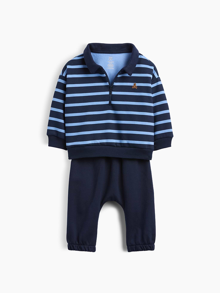 Image 1 of 2, Our softer than soft sweats. Brushed on the inside. Smooth on the outside. Made so that no two are alike., Soft cotton-blend fleece sweatshirt and sweatpants outfit set., Spread polo collar with quarter-zip closure., Long sleeves with drop shoulders., Embroidered Brannan Bear at chest., Striped design., Banded rib cuffs and hem., Elasticized waist and cuffs at pants., Made with 52% Protocol cotton verified by the U.S. Cotton Trust Protocol, a program which works with farms committed to improving their environmental footprint by minimizing water usage and improving soil health (Claim No. 10127)., Made with 23% recycled polyester. Compared to virgin materials, using recycled materials helps reduce resource use and waste., Explore our babyGap Guide ., This product was made in a factory that invests in gender equity and women’s empowerment through RISE. Learn more at gapinc.com/equity ., Product #1193841
