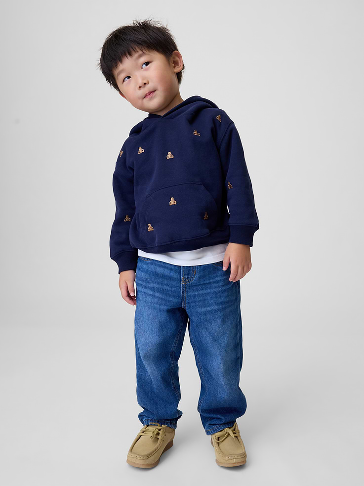 Image 1 of 5, Authentic, non-stretch denim pull-on baggy jeans. With a cozy fleece lining., Elasticized waist with faux fly., Classic five-pocket styling., Fleece lined., Responsibly Made: This pair of jeans is part of our water-saving Washwell program. Compared with conventional wash methods, Washwell uses at least 20% less water., Jeans made with 64% Protocol cotton verified by the U.S. Cotton Trust Protocol, a program which works with farms committed to improving their environmental footprint by minimizing water usage and improving soil health (Claim No. 10127)., More Sustainable Cotton: Made with 5% recycled cotton. Compared to virgin materials, using recycled materials helps reduce resource use and waste., This product was made in a factory that invests in gender equity and women’s empowerment through RISE. Learn more at gapinc.com/equity ., Product #1184951