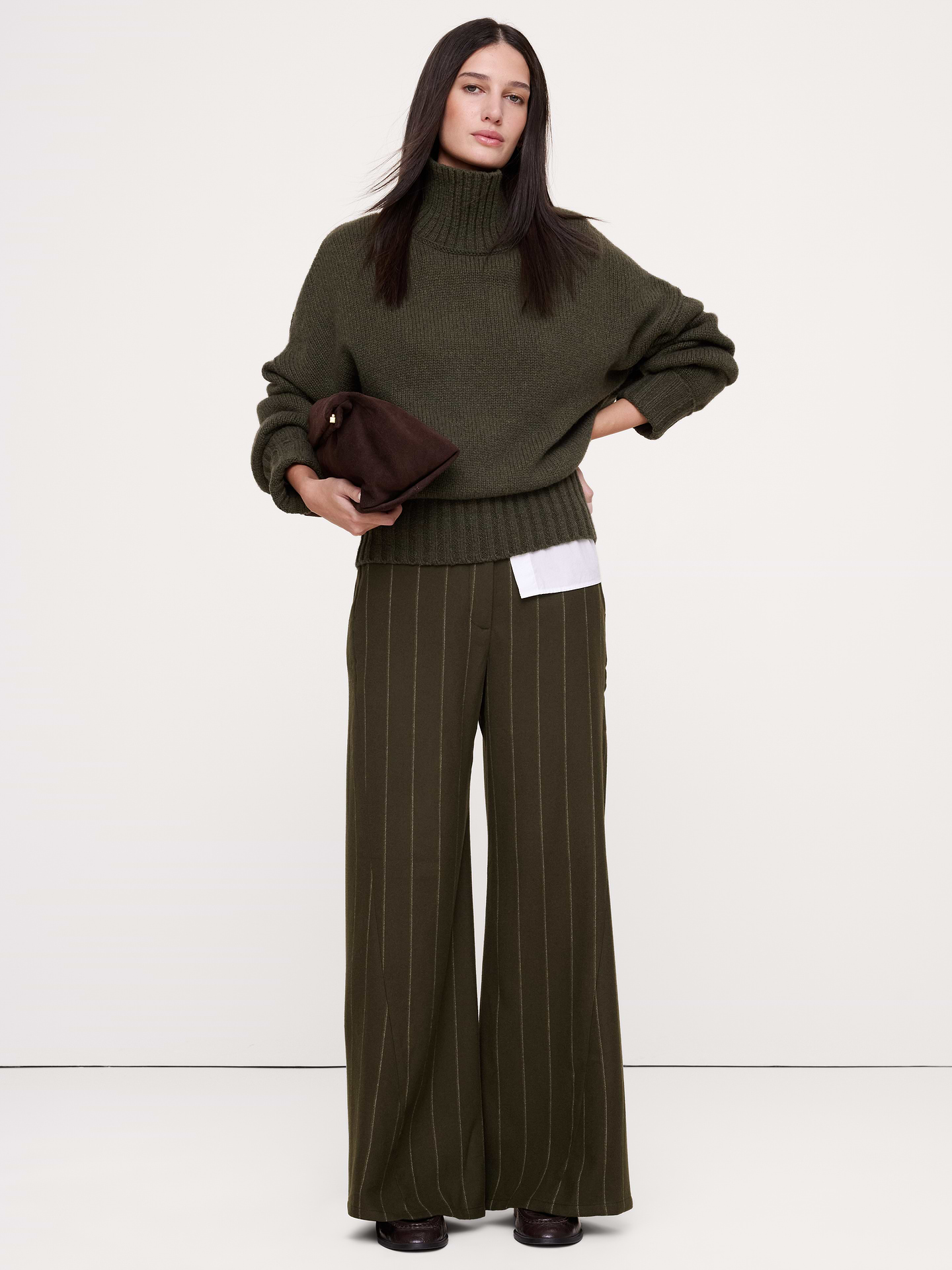 Image 1 of 8, We crafted this high-rise pant from a warm Italian wool-blend flannel and wrapped the outseam forward for a leg-lengthening silhouette., High-Rise Wide-Leg: High rise. Fitted waist, relaxed through the hip and thigh with a wide flared leg. Twisted seam., Fabric from Italy's Manifattura Emmetex., Zip fly with hook-and-bar closure. Belt loops., Elastic waist at back., Front and back pockets., Unlined., Product #1183002