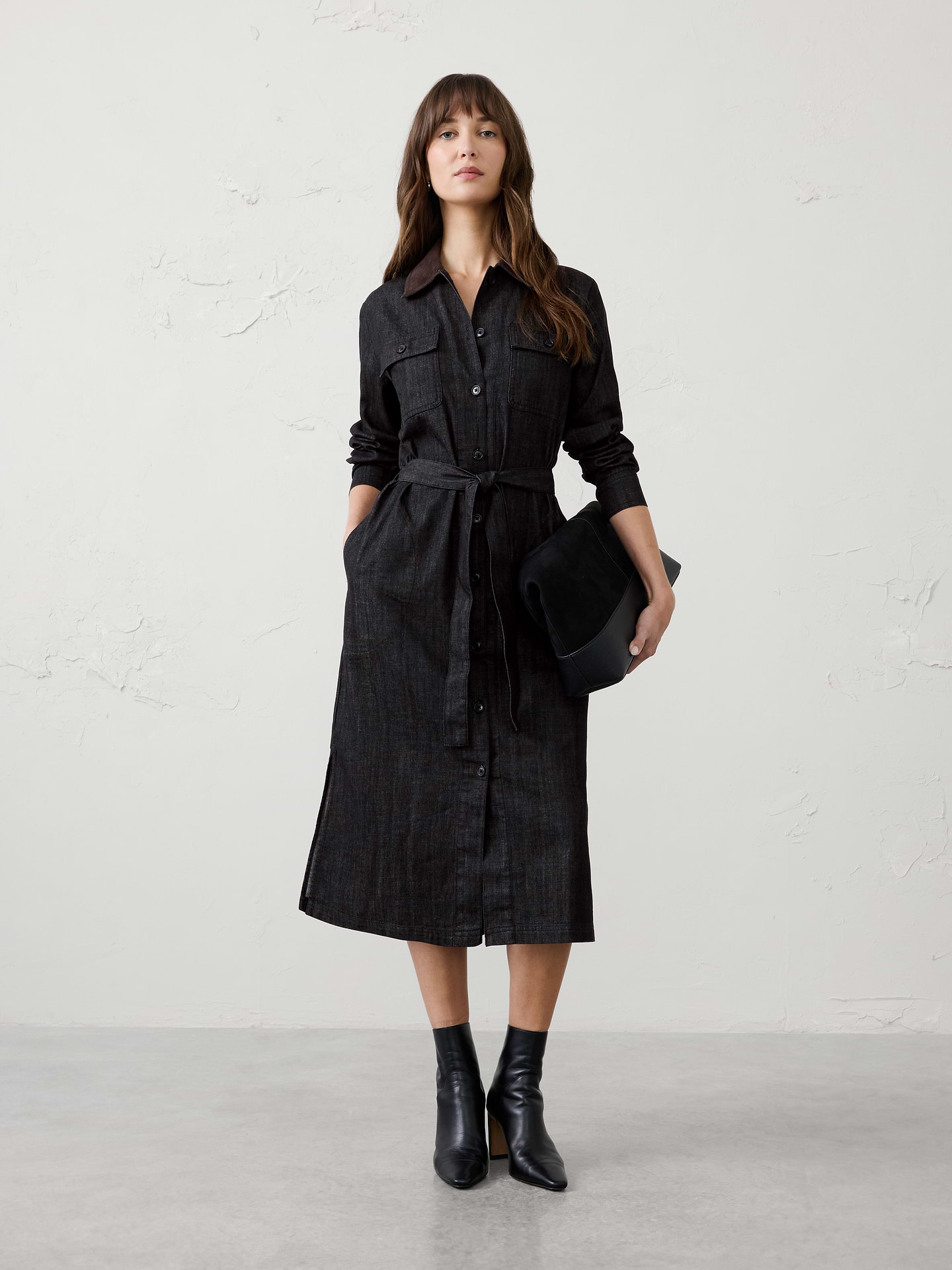 Image 1 of 4, A fresh take on a timeless favorite, this contrast-collar shirtdress combines soft chambray with heritage-inspired corduroy accents for effortless everyday style., Contrast corduroy collar. Long sleeves with button cuffs., Full button-front closure., Dual chest flap pockets with button closures., On-seam side pockets., Removable self-tie belt., Center-back seam detail., Made exclusively for Banana Republic Factory., Product #1185697