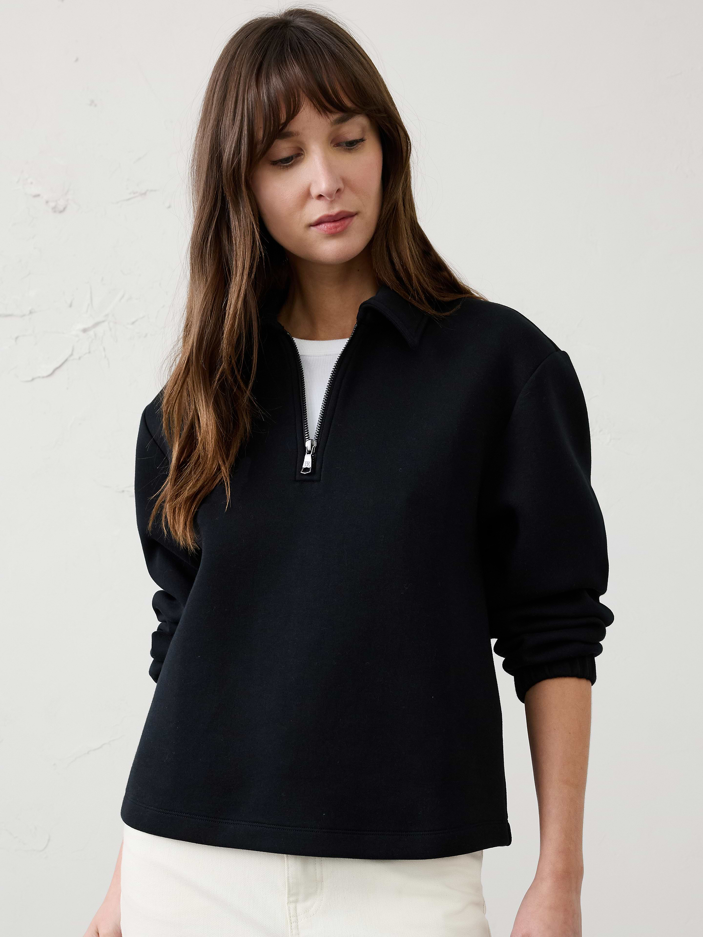 Image 1 of 4, Crafted from our best‑selling Weekender fabric, this sweatshirt combines exceptional softness with built‑in stretch for all‑day comfort and ease of movement. Comfortable yet polished, it’s an effortless go‑to for everyday wear., Point collar. Long sleeves with elasticated cuffs., Drop shoulders., Quarter zip placket., Made exclusively for Banana Republic Factory., Product #1186023