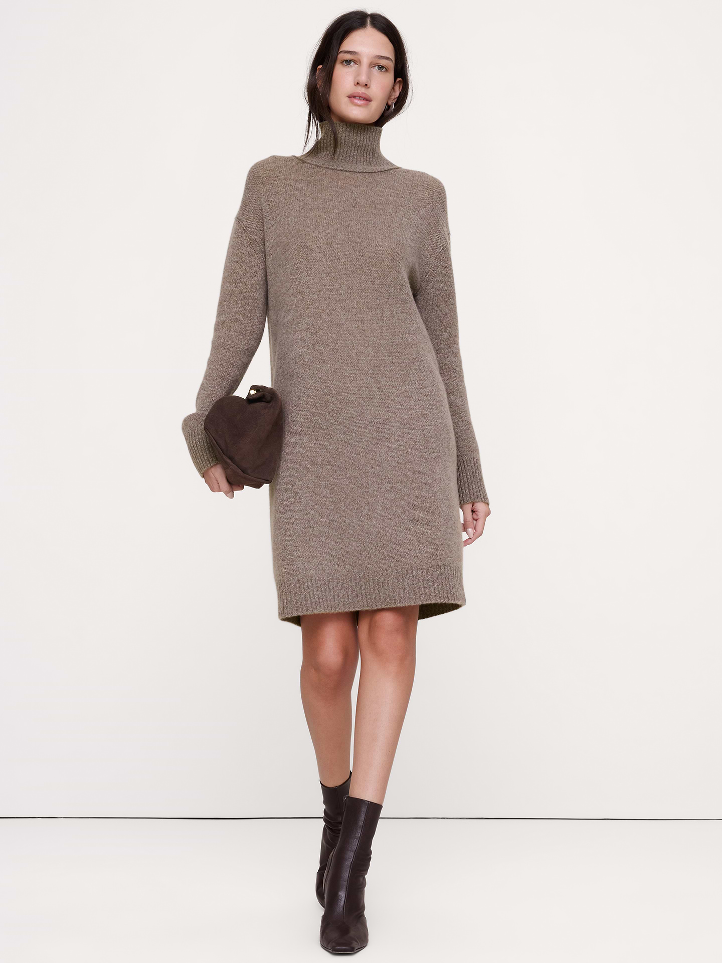 Image 1 of 8, The vibe is lightweight luxury. This cashmere sweater dress has a relaxed fit, knitted in our lightweight cashmere yarn—selected for its softness and all-season weight., Shift fit: Relaxed shoulders, straight through bust, waist and hip with a straight skirt., Turtleneck., Pull-on design., Unlined., Product #1182095
