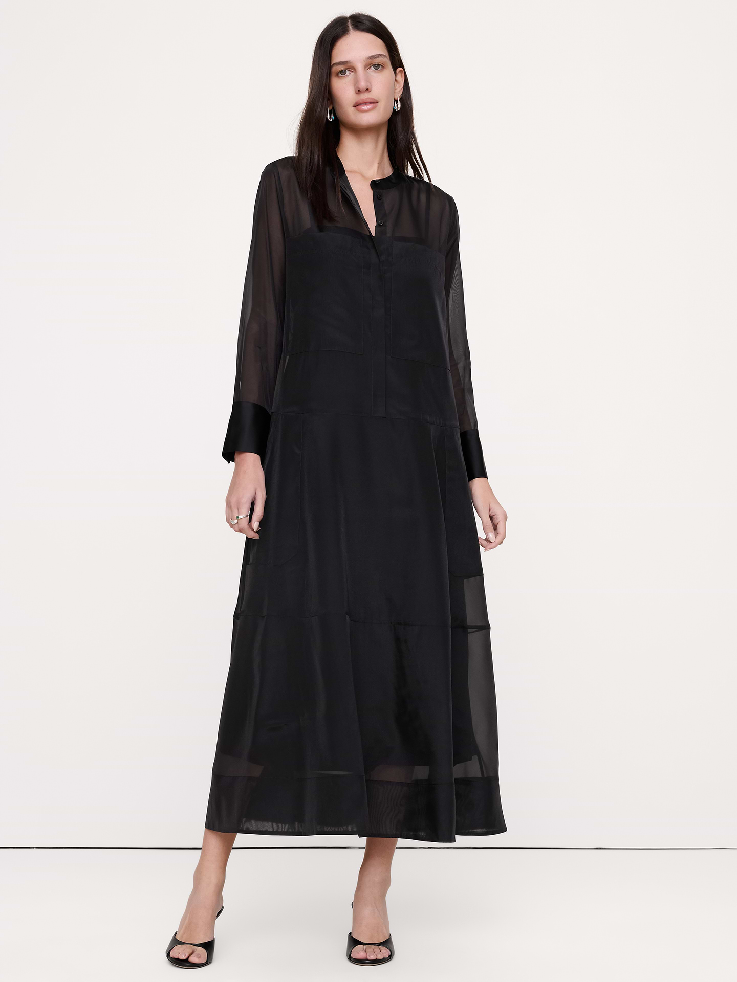 Image 1 of 5, An exploration of luxe utility, this flowing shirt dress employs a classic button-down bodice. Cut in sheer organza, inviting you to play with layers., Trapeze Fit: An easy fit with an A-line silhouette., Banded collar with button front., Camisole slip lining., Product #1180136