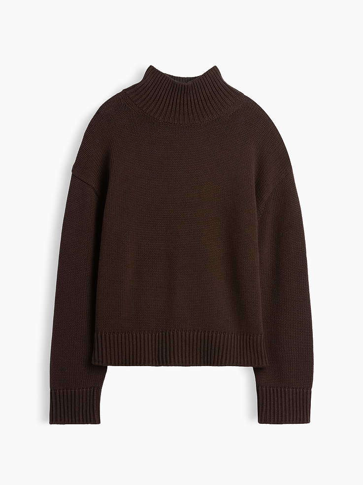 Image 1 of 2, Soft knit cotton sweater. In an oversized fit and slightly cropped length., Mockneck., Long sleeves with drop shoulders., Ribbed cuffs and hem., This product was made in a factory that invests in gender equity and women’s empowerment through RISE. Learn more at gapinc.com/equity ., Product #1186084