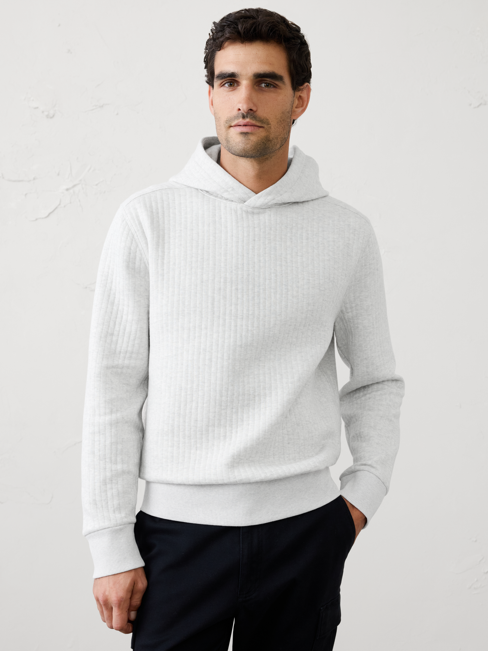 Image 1 of 3, Crafted from a soft quilted fabric, this hoodie delivers lightweight warmth with a textured, elevated look. Designed for easy layering, it offers all‑day comfort and versatility., Hooded. Long sleeves., Ribbed arm cuffs and hem., Made exclusively for Banana Republic Factory., Product #1181075