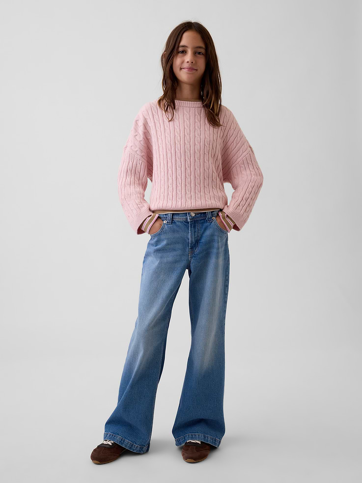 Image 1 of 6, Low-stretch denim relaxed flare jeans., Button closure at adjustable waist (sizes 4-8 have a hook & bar closure beneath faux snap for easy on and off), zip fly., Classic five-pocket styling., Medium wash., Responsibly Made: This pair of jeans is part of our water-saving Washwell program. Compared with conventional wash methods, Washwell uses at least 20% less water., More Sustainable Cotton: Made with 5% recycled cotton. Compared to virgin materials, using recycled materials helps reduce resource use and waste., This product was made in a factory that invests in gender equity and women’s empowerment through RISE. Learn more at gapinc.com/equity ., Product #1185395