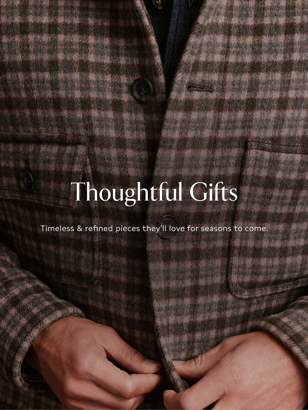 Close-up of hands buttoning a brown plaid wool coat, with overlaid text reading “Thoughtful Gifts—Timeless & refined pieces they’ll love for seasons to come.”