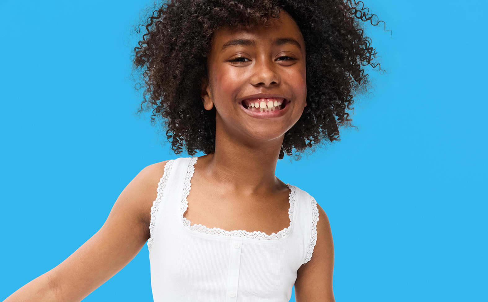 Image of a young girl model wearing an Old Navy white top.