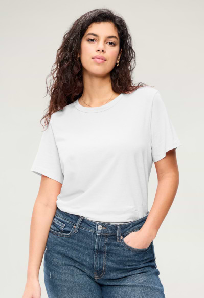 A female model wearing a basic short sleeve t-shirt.