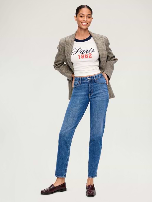 A straight leg medium-wash jean paired loafers and a blazer.