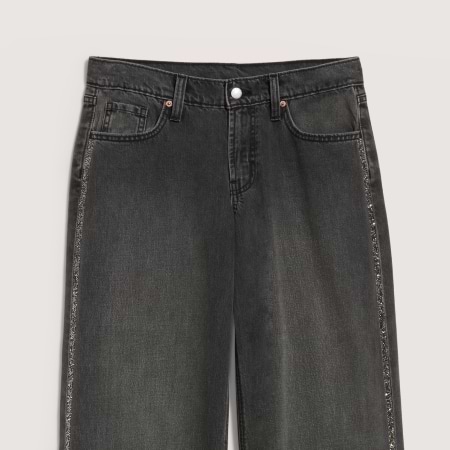 Dark indigo denim jeans, front view, classic five-pocket design with contrast stitching and button closure.