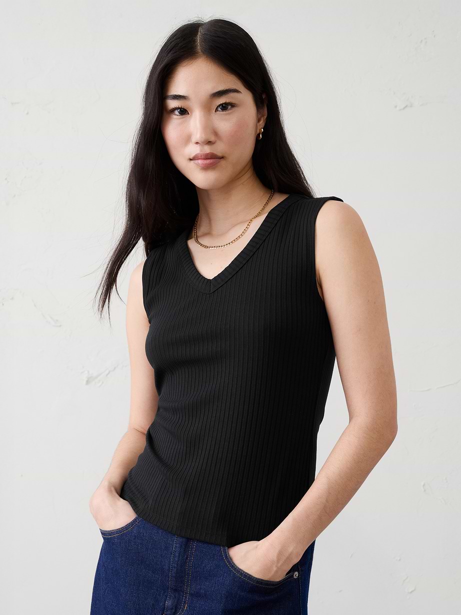 Woman in black tank top. 