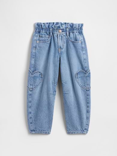 Light blue kids’ jeans with elastic paperbag waist, front pockets, and heart-shaped knee patches.
