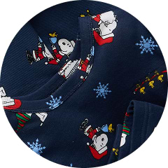 Navy fabric with Snoopy and Woodstock in holiday outfits and blue snowflakes.