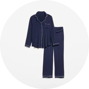 Navy pajama set with white piping: long-sleeve button-up top with pocket and matching pants.