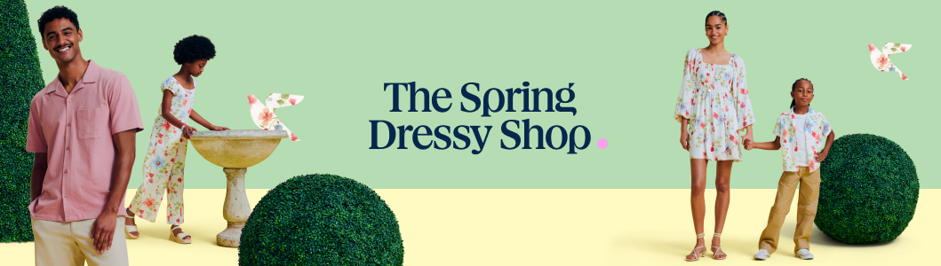 Banner reading “The Spring Dressy Shop” with models in pastel and floral outfits among cone and sphere topiary, floral bird cutouts, and a birdbath on a mint-green and pale-yellow background.