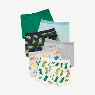 Assorted kids’ boxer briefs, solids and dinosaur prints in varied colors.