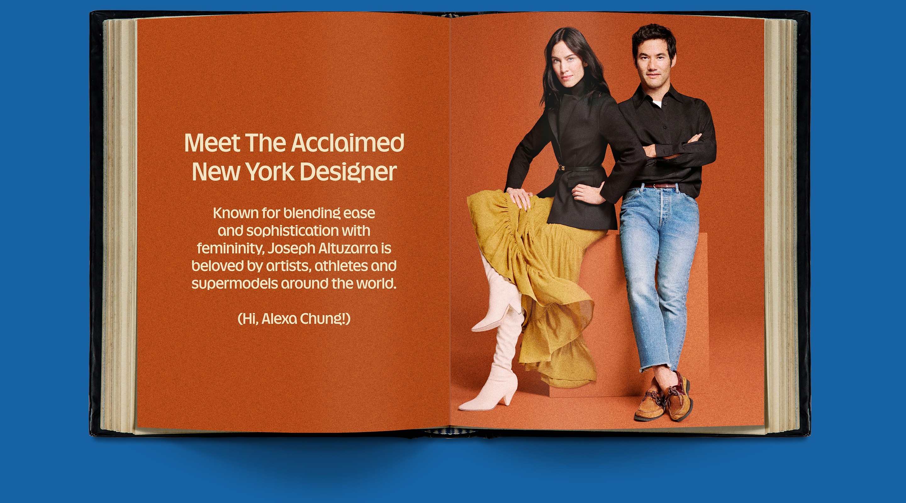 Open book spread with orange pages; left page reads “Meet The Acclaimed New York Designer.” Right page shows two people posing—one in a black top, yellow skirt, white boots; the other in a black shirt and blue jeans.