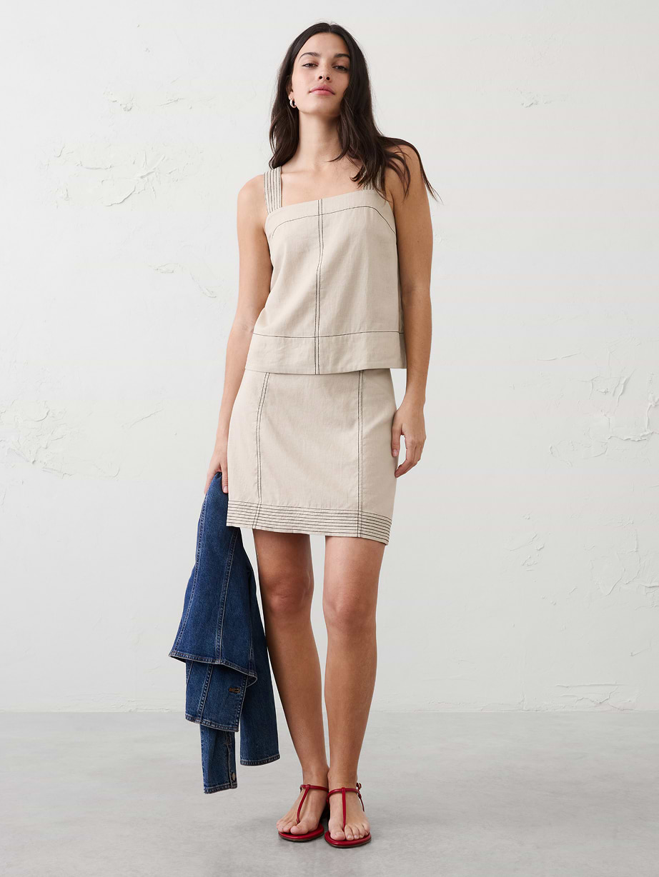 Woman in tan linen mathcing set.