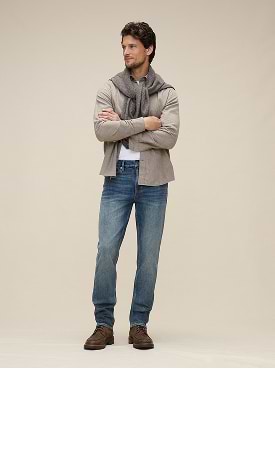 Slim. Well-fitted through the thigh with a narrow leg