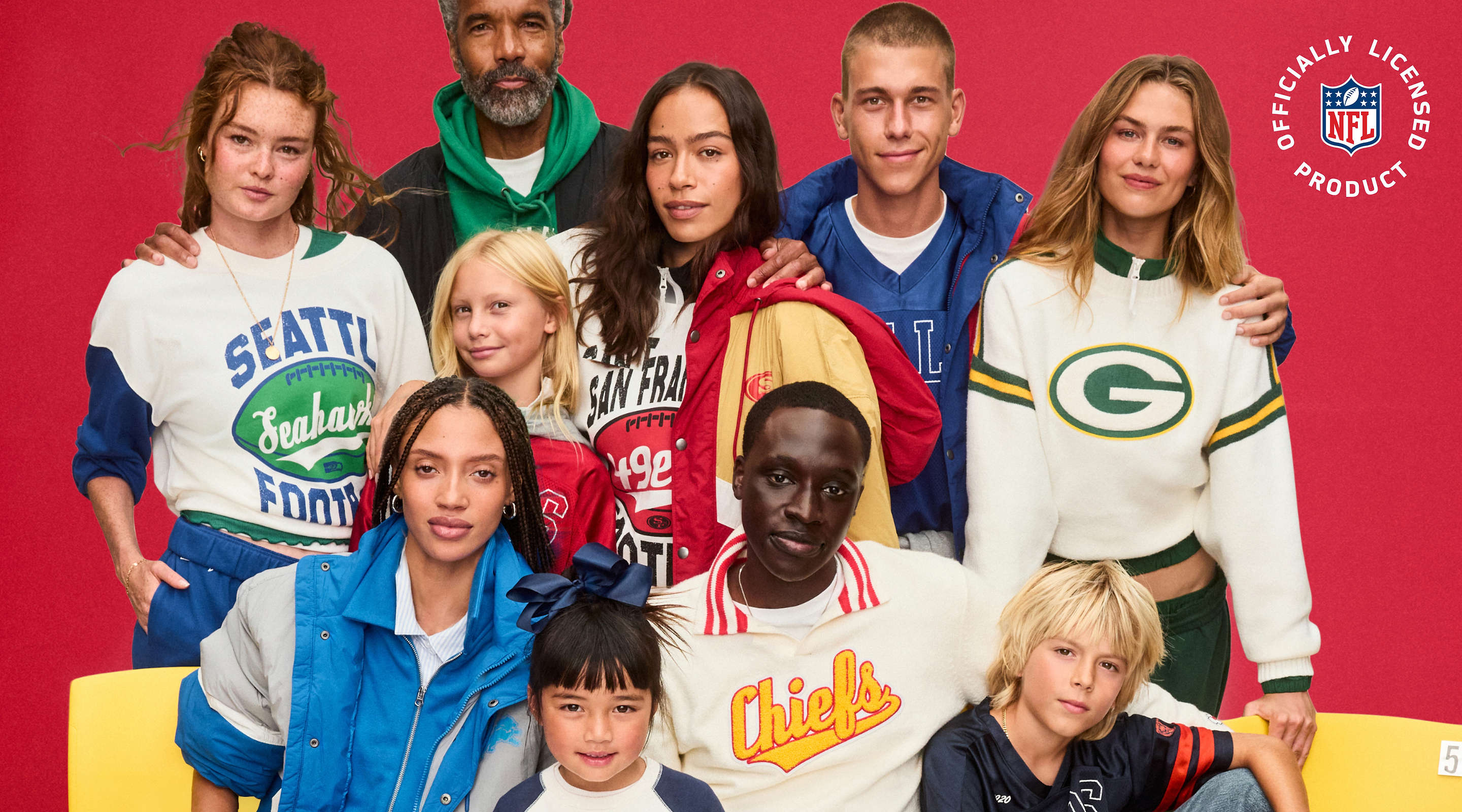 Group of adults and children wearing NFL team gear—Seahawks, 49ers, Packers, and Chiefs—posing on yellow bleachers against a red background, with an “Officially Licensed NFL Product” logo in the top right.
