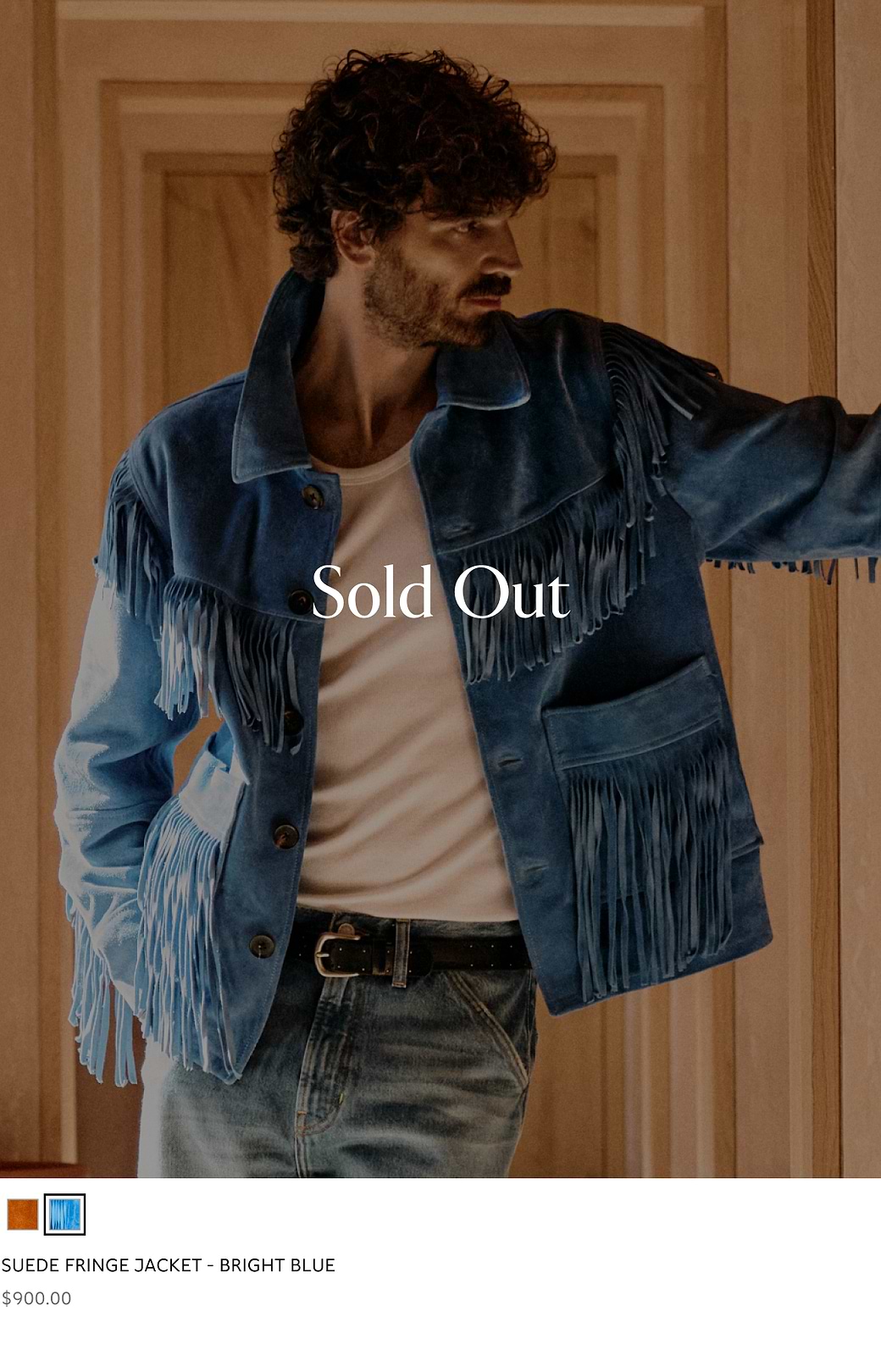 Bright blue suede fringe jacket with tassels on a model; overlay text reads “Sold Out.”