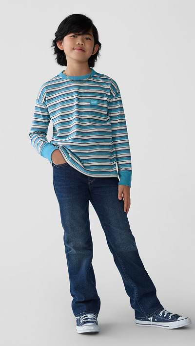 A male model wearing boot-cut built-in flex jean and striped crew neck softest long sleeve tee.
