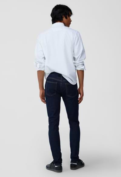 A male model wearing skinny jeans.