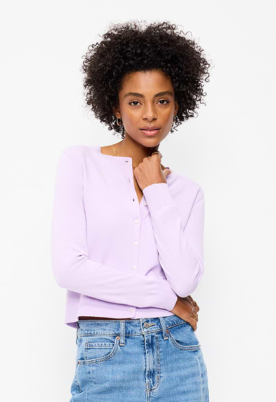 A female model wearing a light purple cardigan.